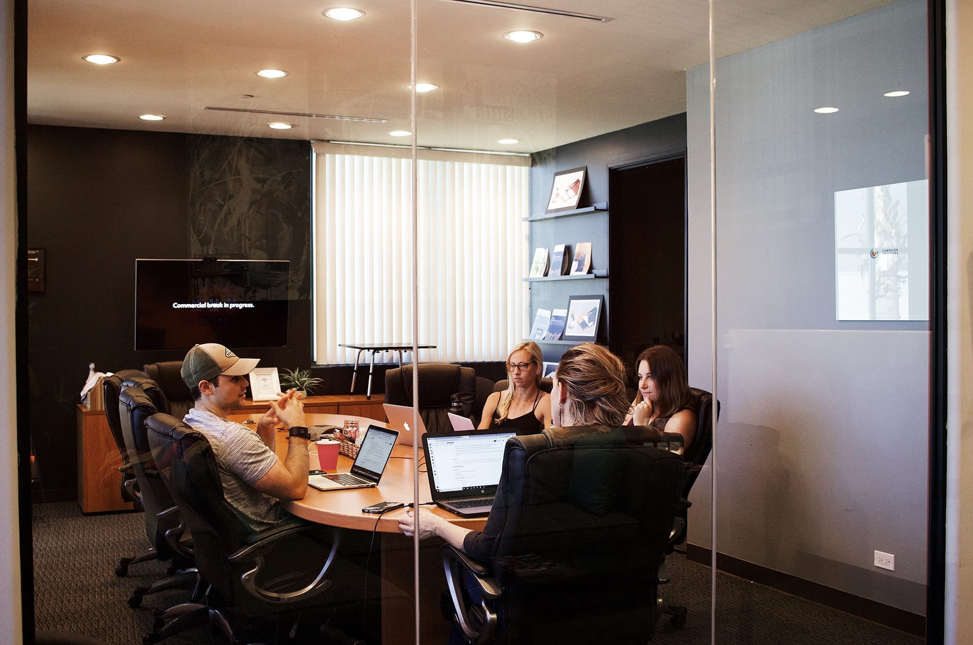 people in a meeting casually dressed in an office