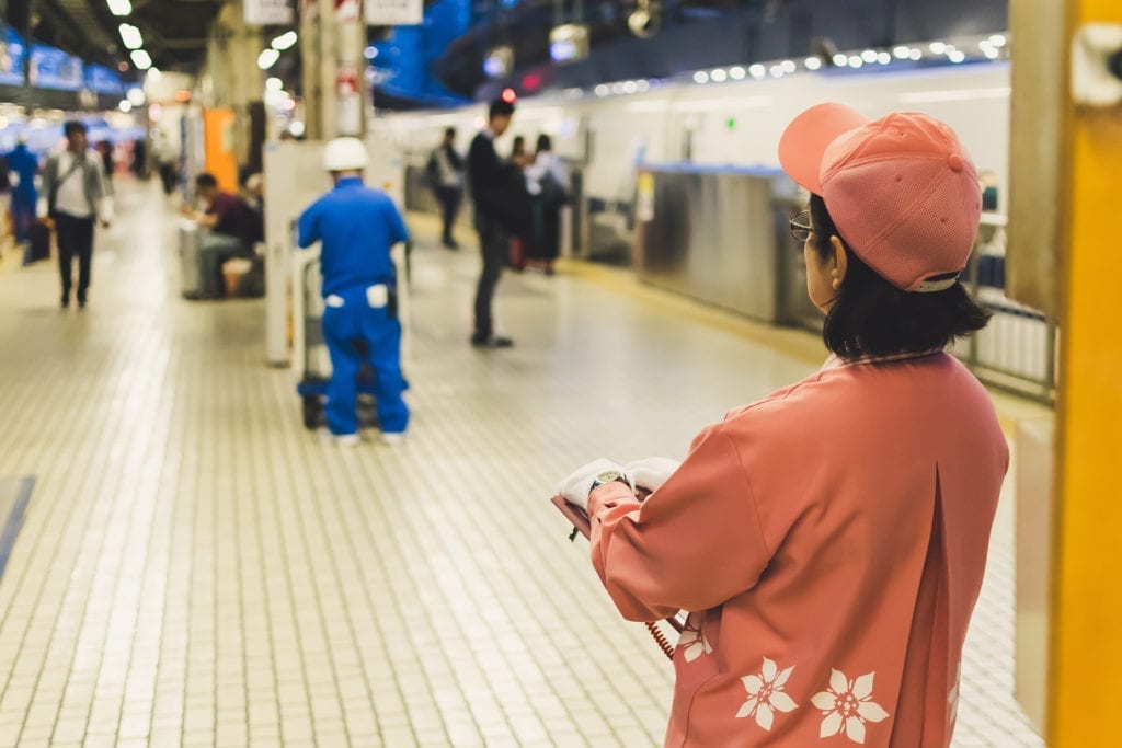 woman stands in subway