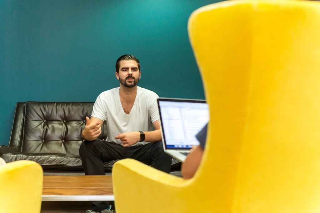 two people having a meeting on a couch