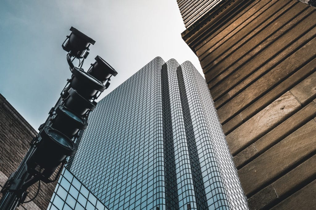 low angle shot of film equiment lights and skyscraper