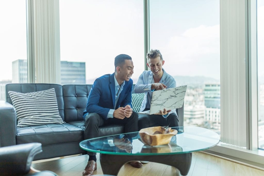 investor and entrepreneur sitting on couch