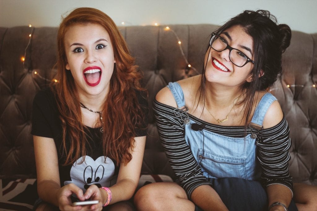 two friends sitting on couch