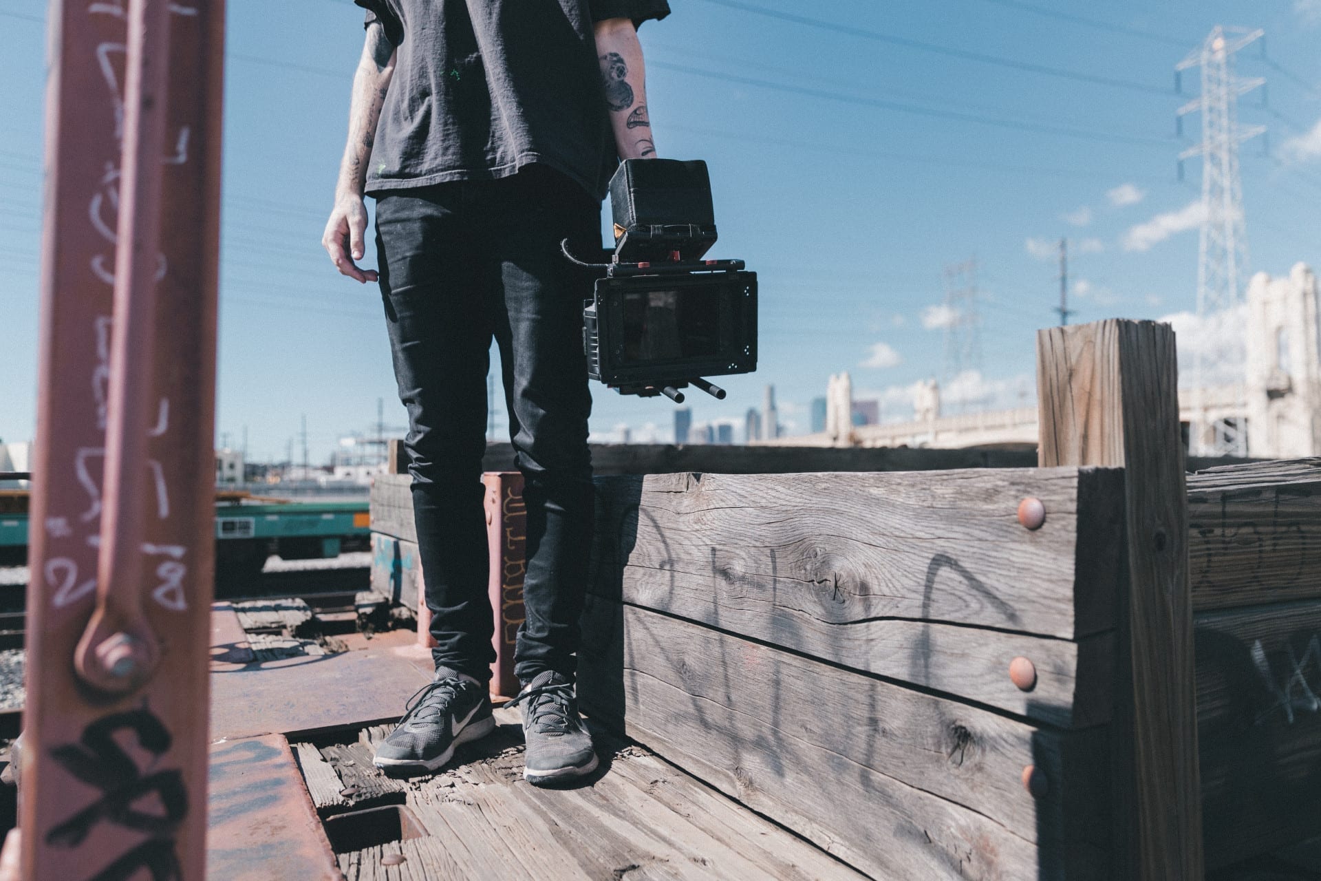 filmmaker holding camera with film crew