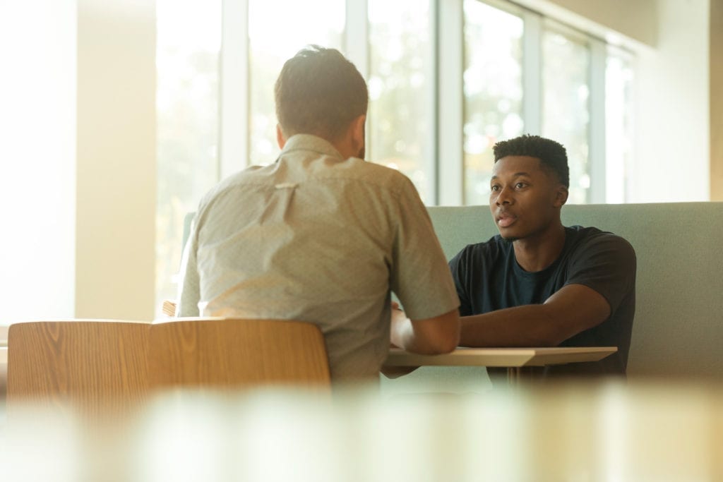 young men having meeting