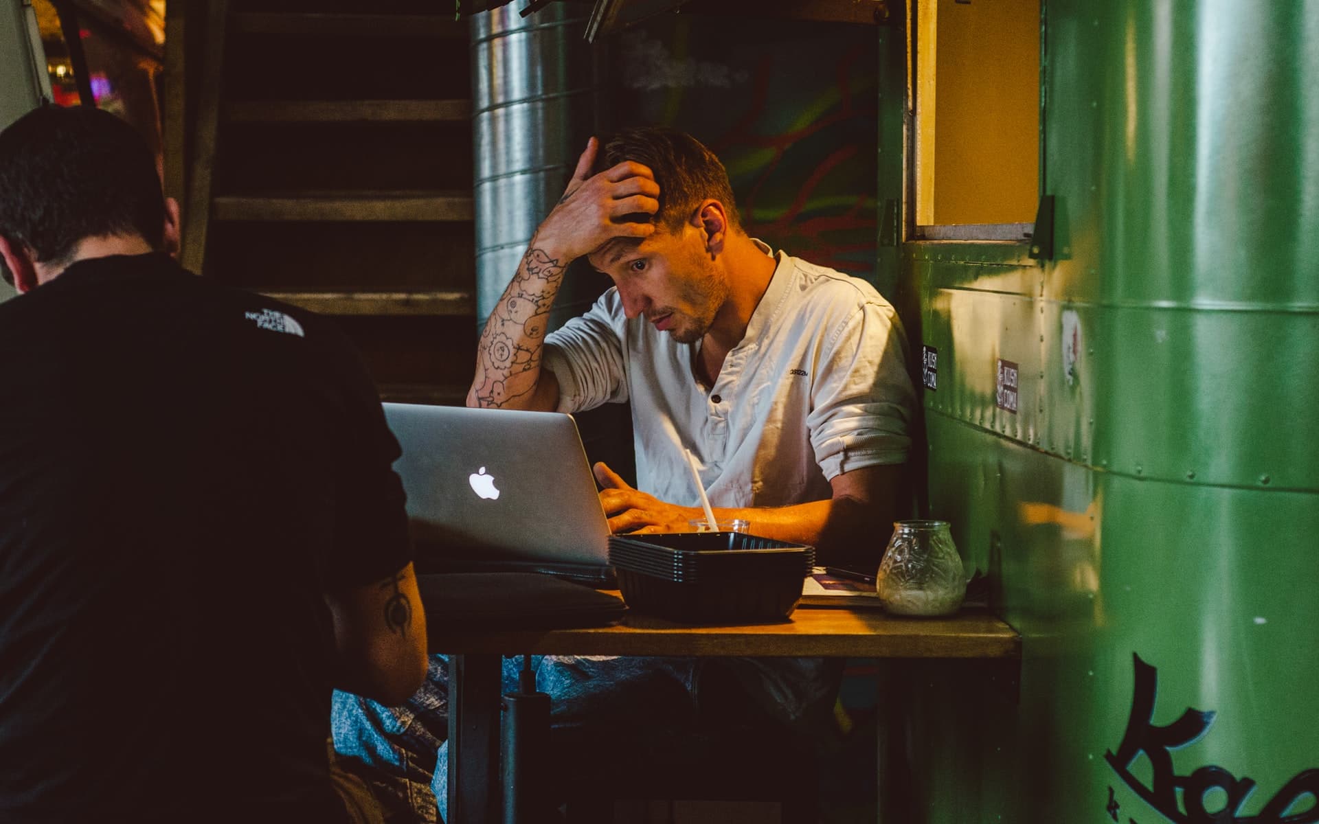 filmmaker sitting at laptop submitting short films to festivals