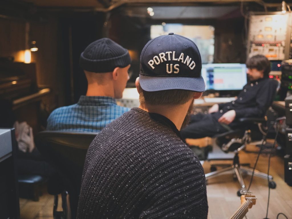 film producer on set short film wearing backwards hat