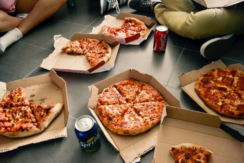 pizza boxes on floor with soda cans independent film