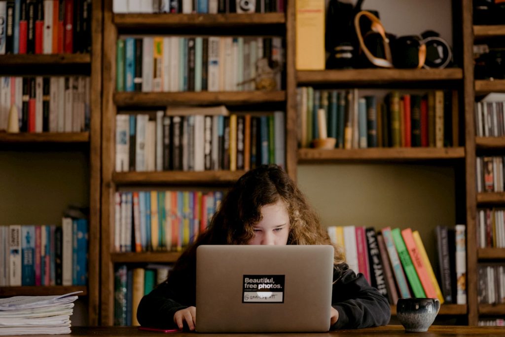 A girl typing on her laptop