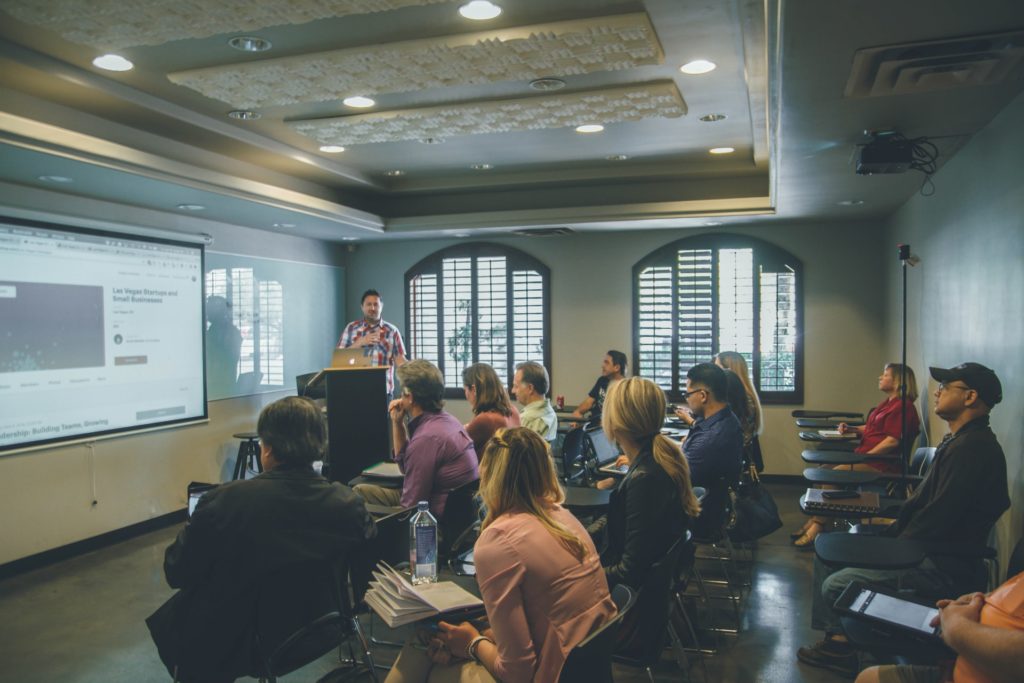 A person pitching their idea to a crowd