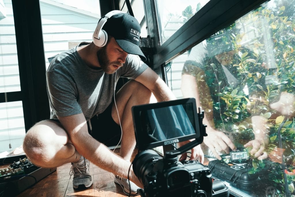 cinematographer setting up camera for filming the film fund