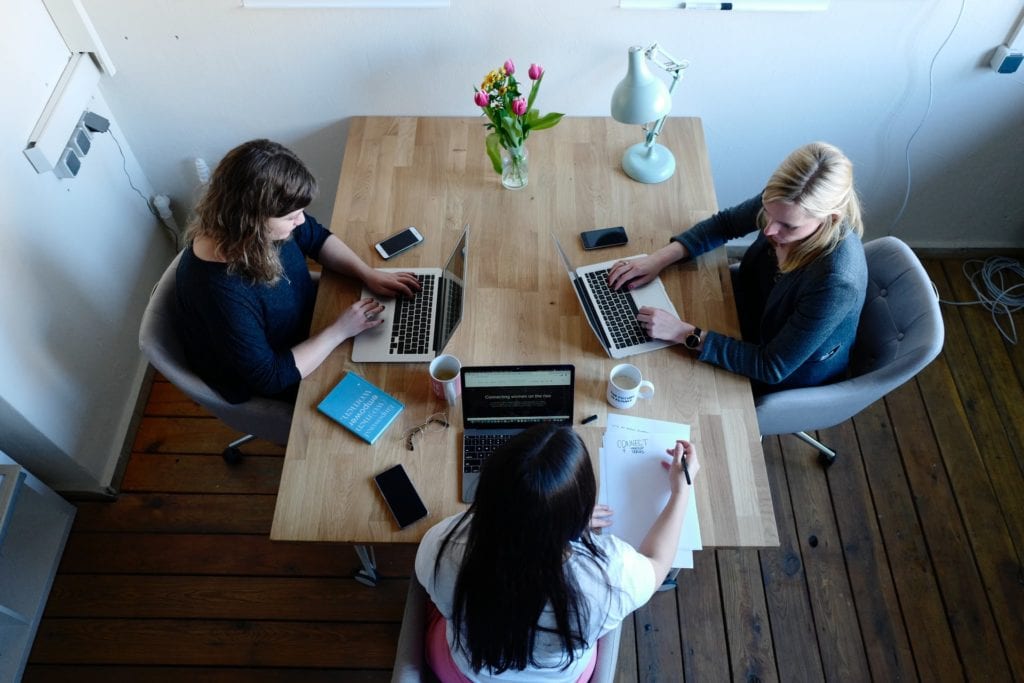 three women having a discussion over their computers the film fund