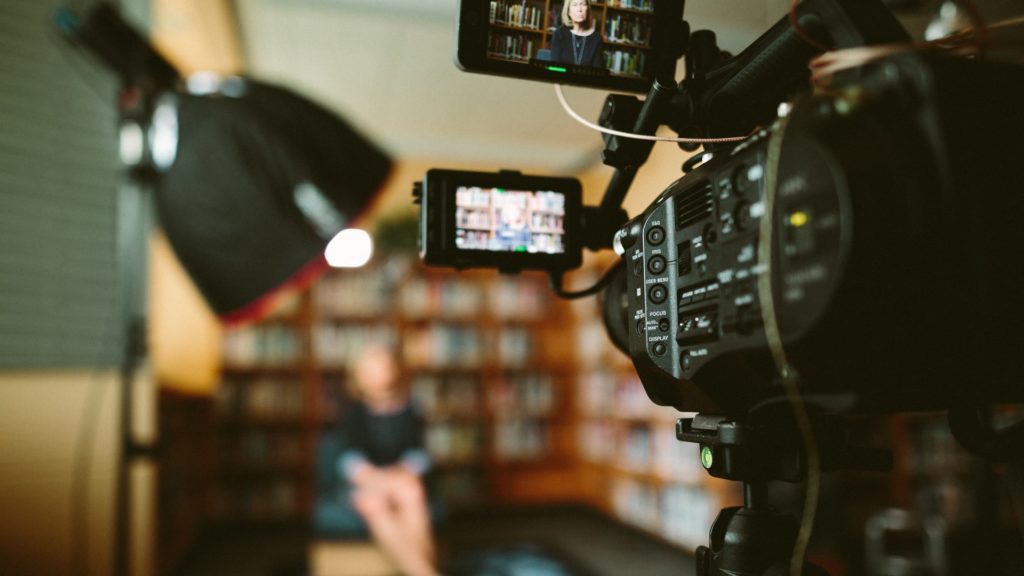 camera angled toward woman being interviewed the film fund