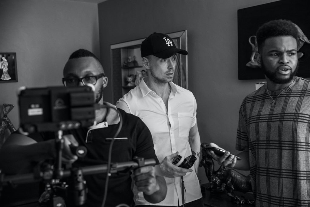 three men working together during production the film fund