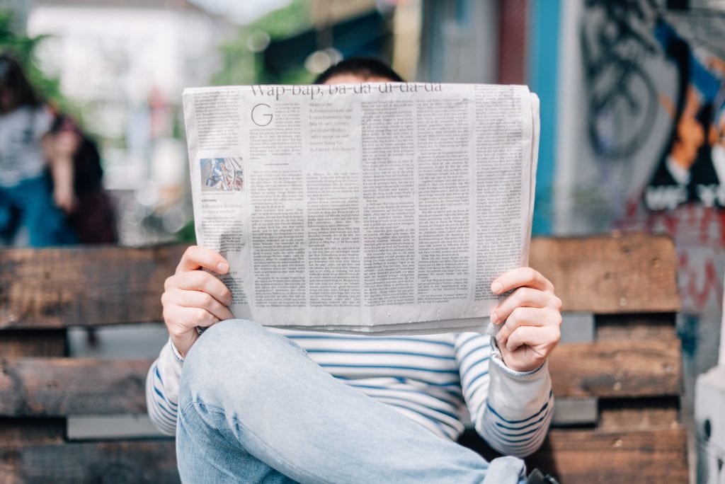 someone reading a newspaper the film fund