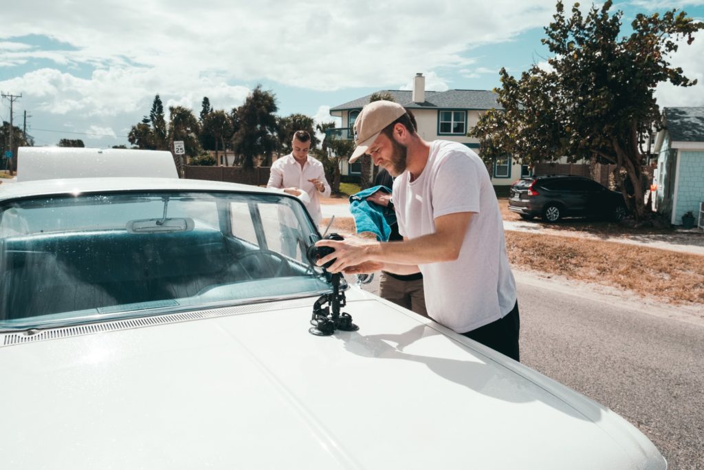 three men helping on a film set the film fund