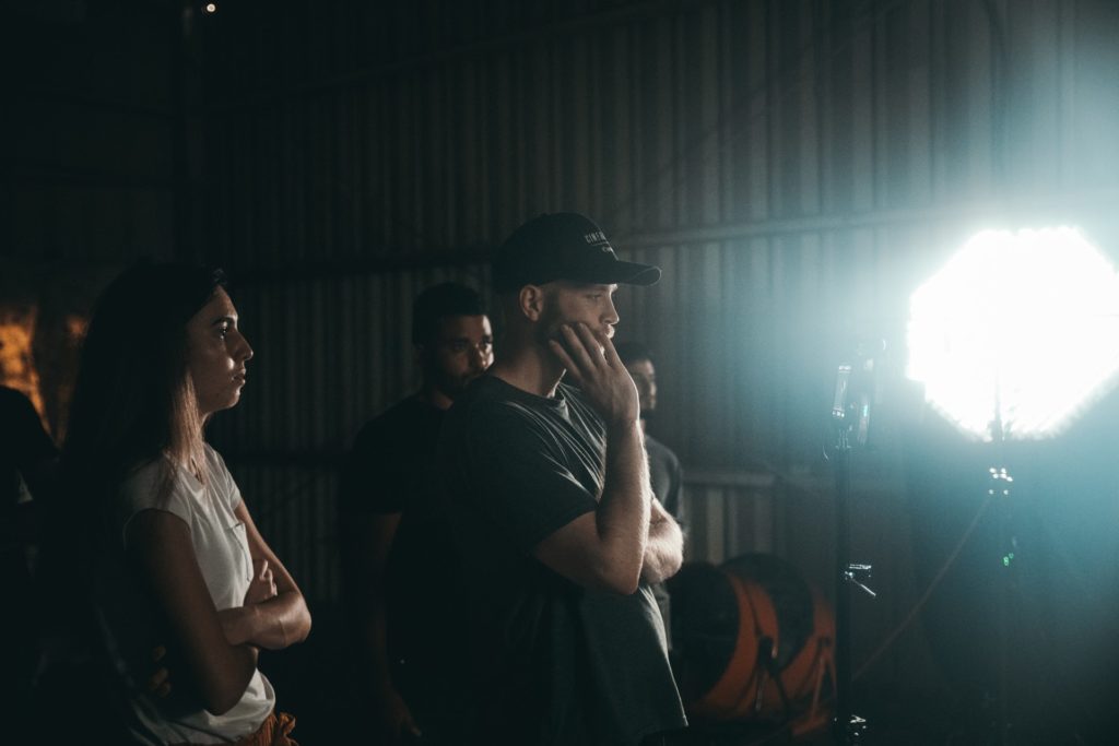 filmmakers on a set during filming the film fund