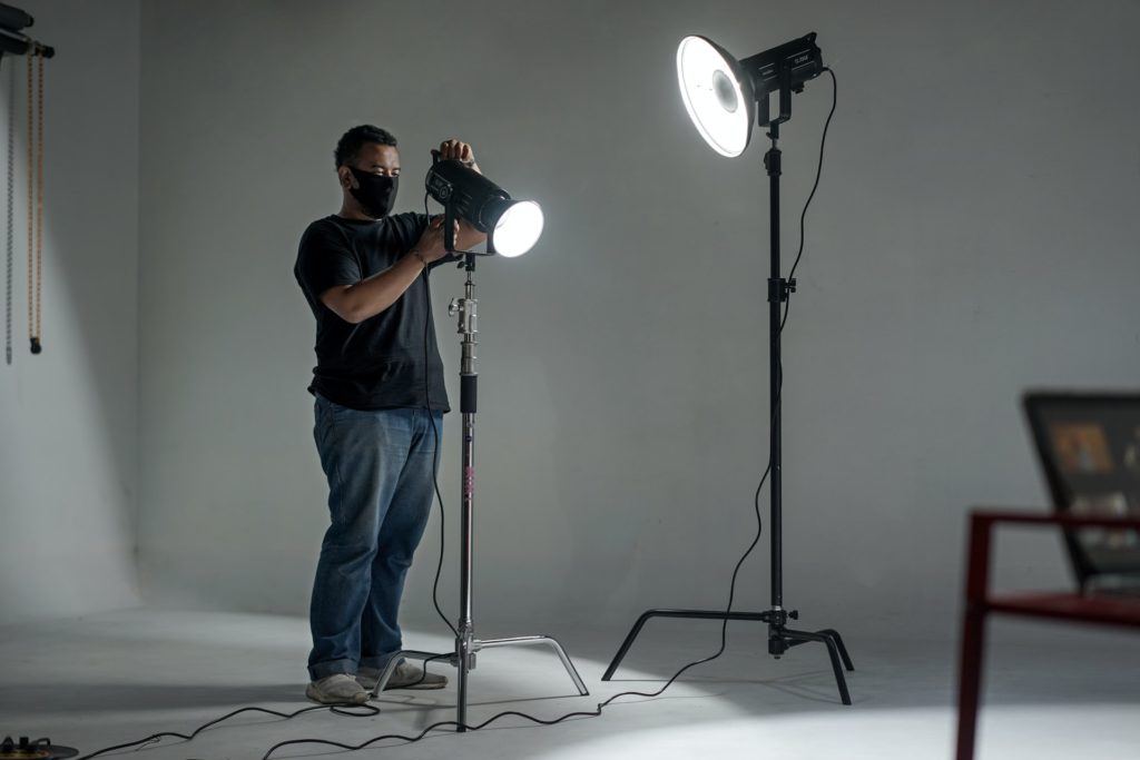 man working with lights on set the film fund